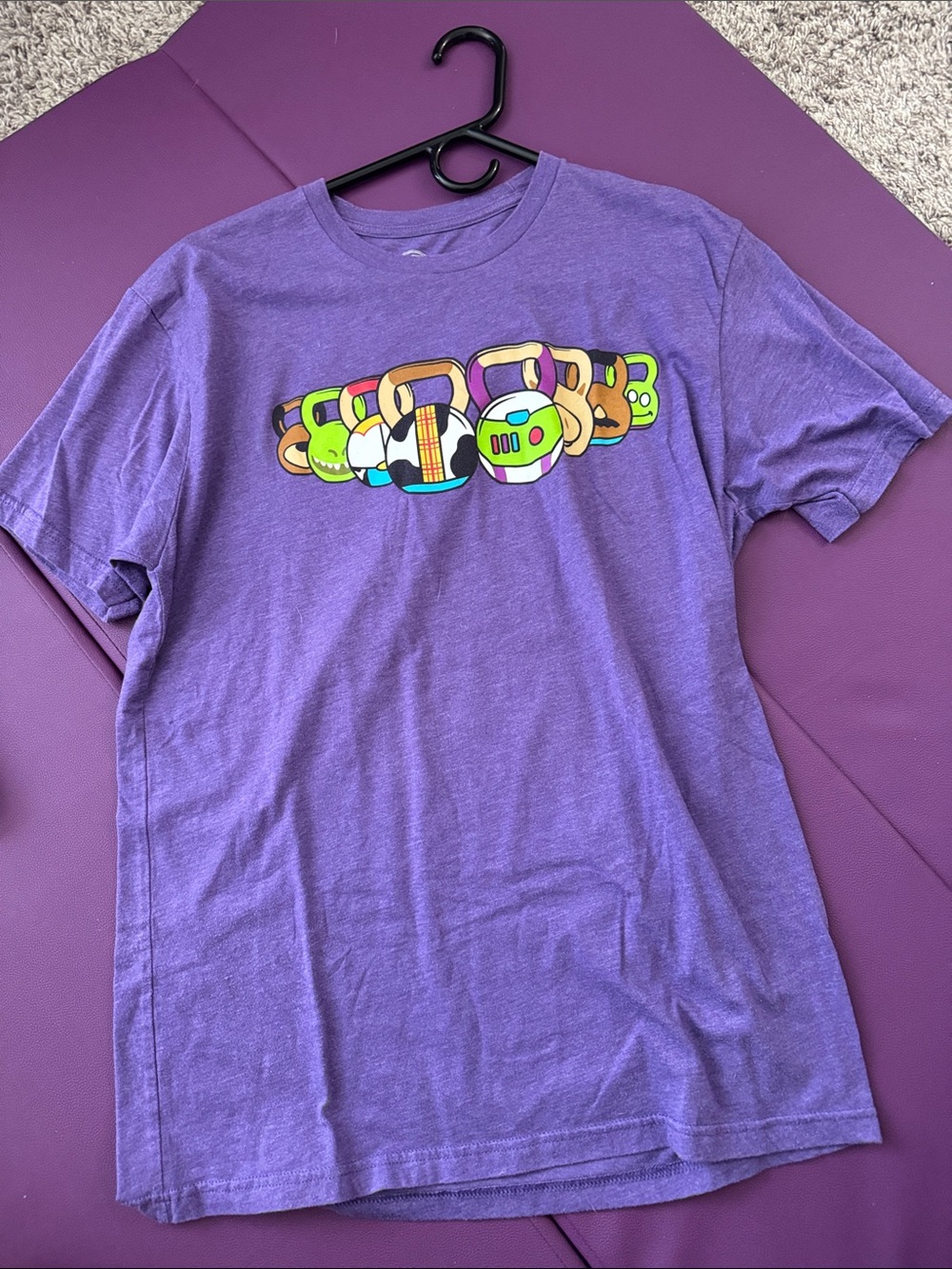 Purple Short-Sleeve Graphic Tee with Colorful Character Icons